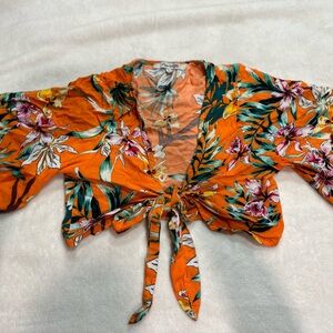 S Orange shirt with flowers ties up through the front super cute only wore 2x